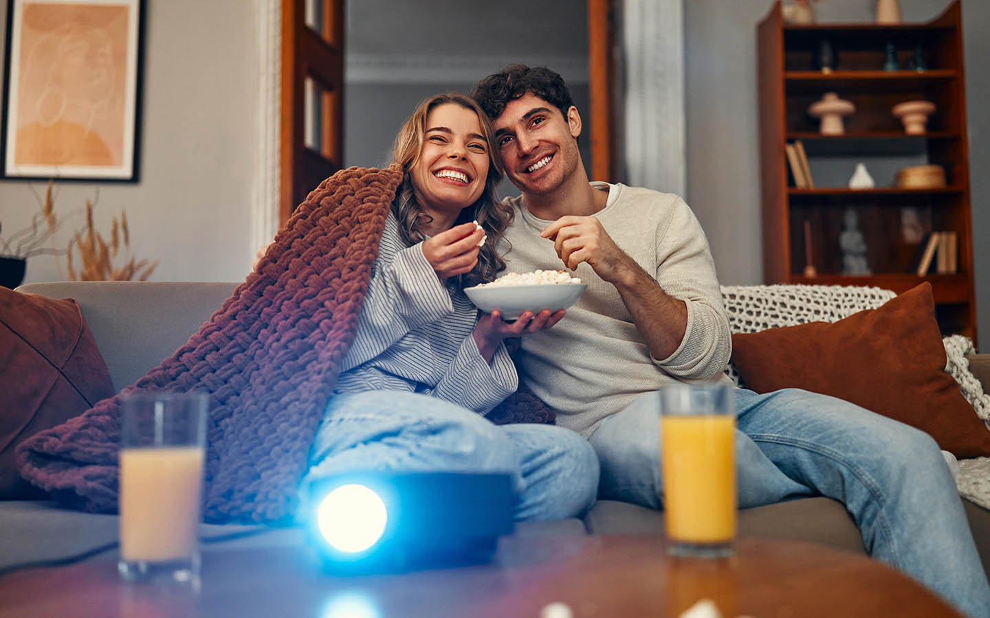 couple watching movie can be a romantic ideas for Valentine's Day at home
