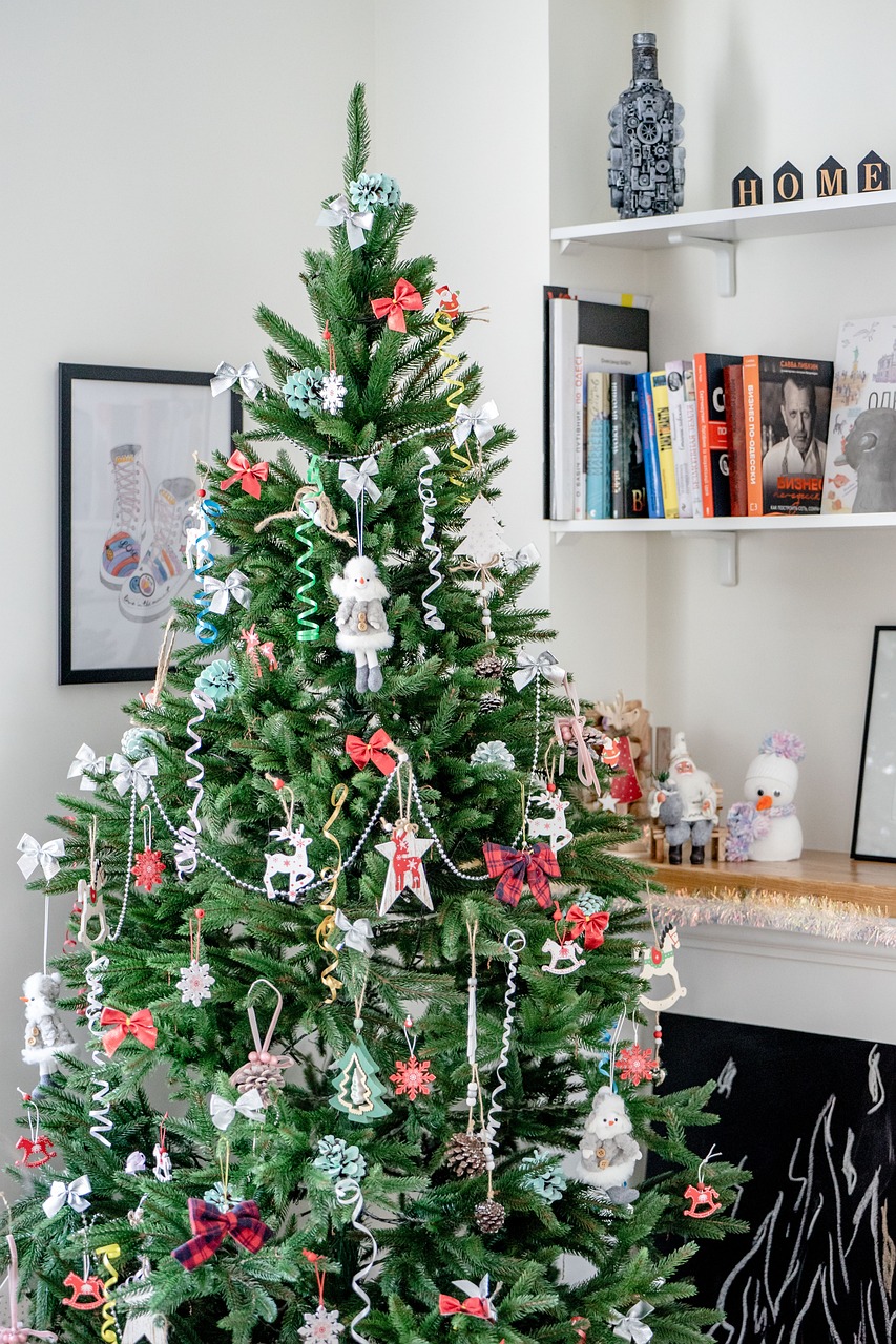 Alt Text: A green Christmas tree with a lot of red, white and green ornaments on it