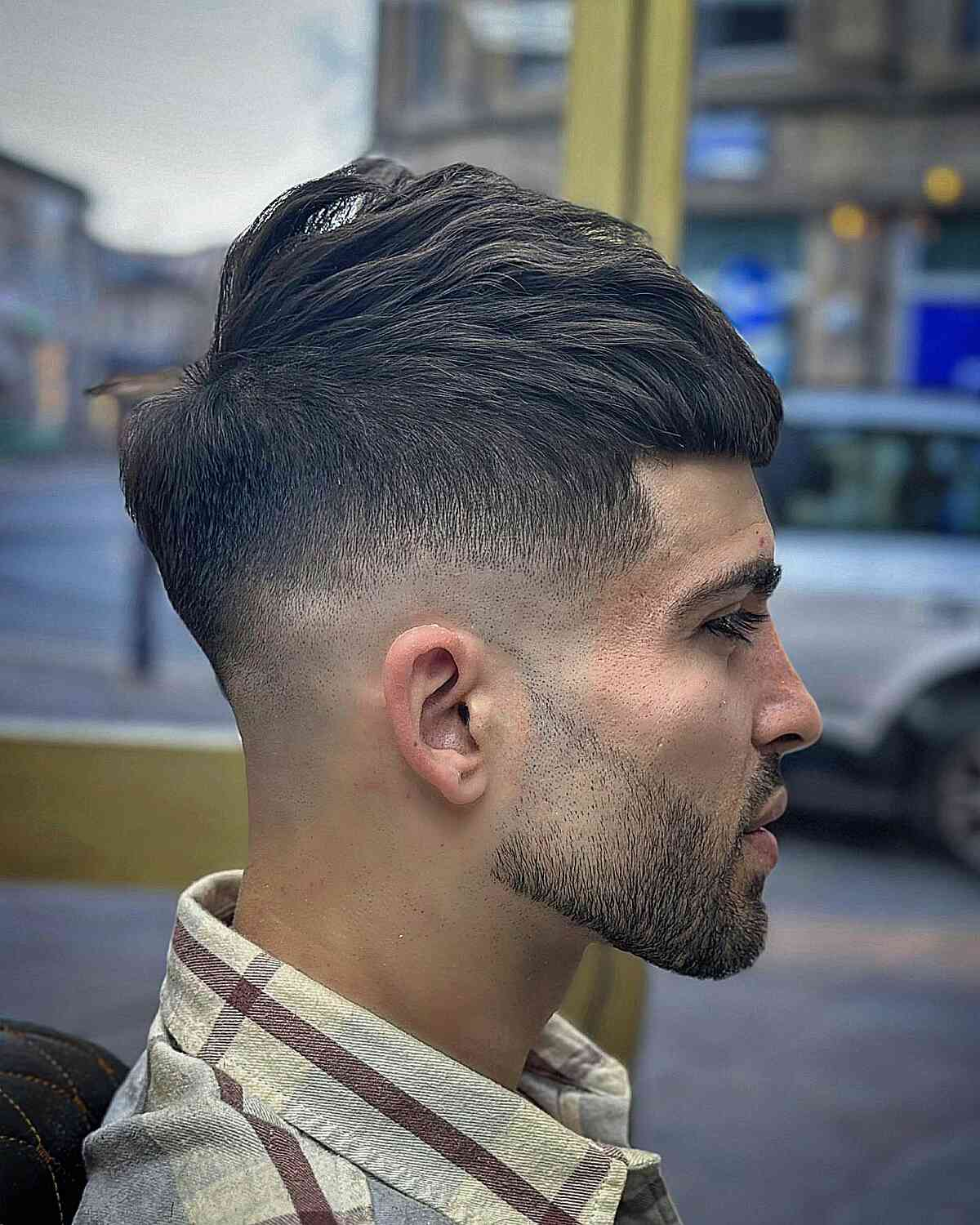 Picture  showing a guy rocking the simple drop fade cut