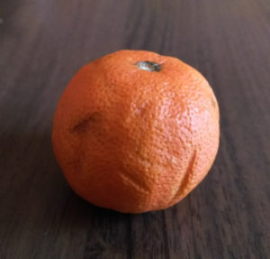 A close up of an orange

Description automatically generated