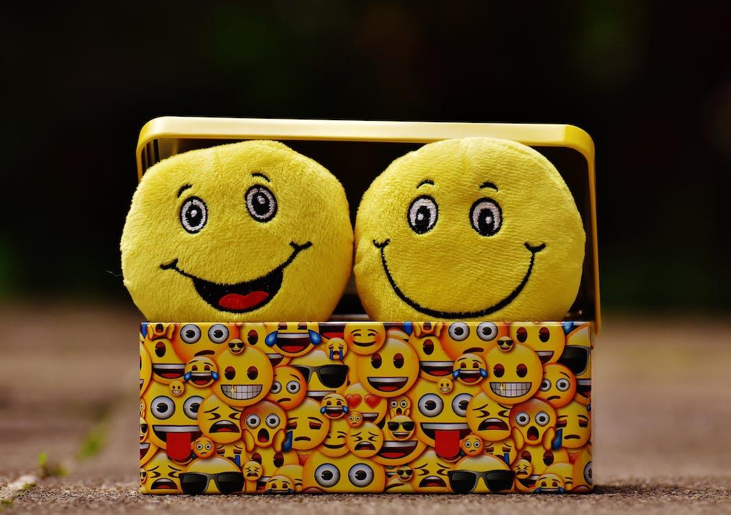 Free Two Yellow Emoji on Yellow Case Stock Photo