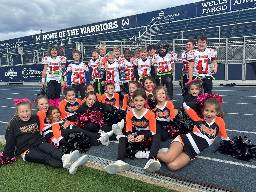 A group of cheerleaders posing for a photo Description automatically generated