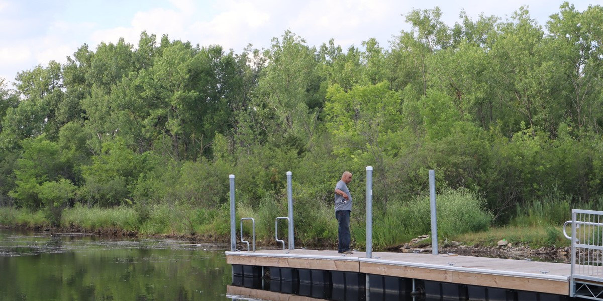 A person fishes from a pier in Hegewisch.