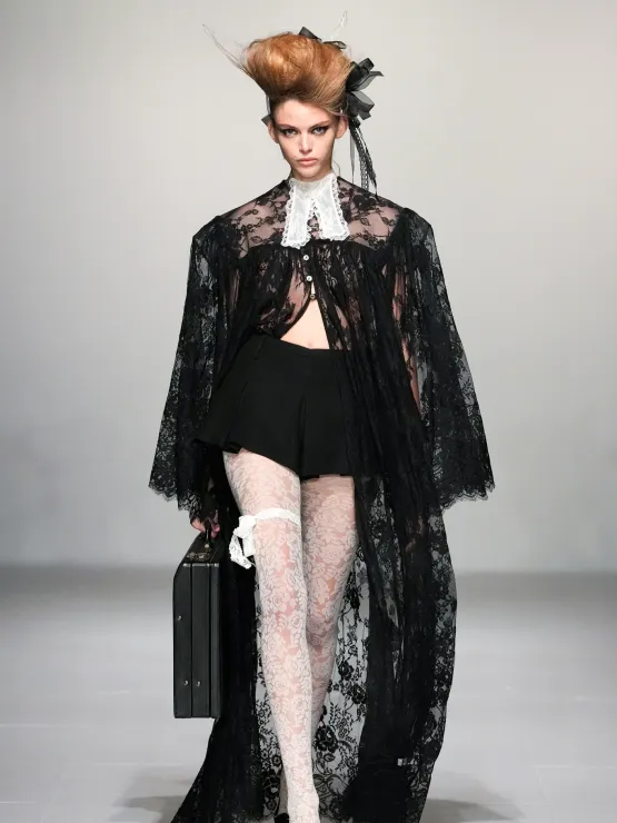 London Fashion Week AW24: Picture showing a model  dressed in a sheer lace for Susan Fang