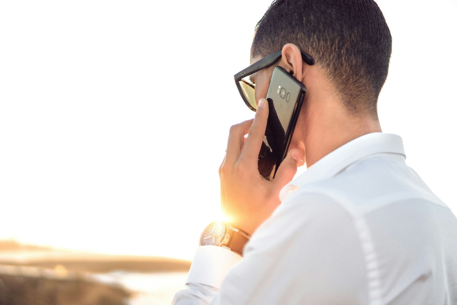 A man receiving a scam debt collector call