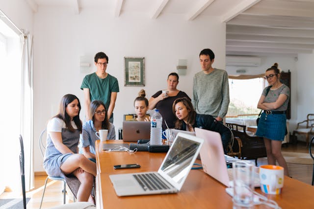 A group of people in the office discussing and planning for a specific target