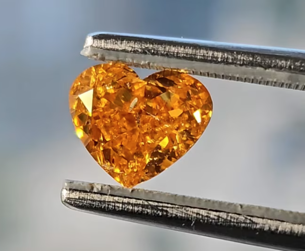1.51 carat fancy vivid yellow orange diamond