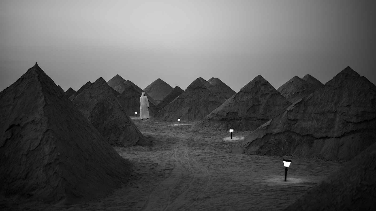 Black and white photo of Self Similar, a mandala made of pyramids in the desert outside Abu Dhabi.