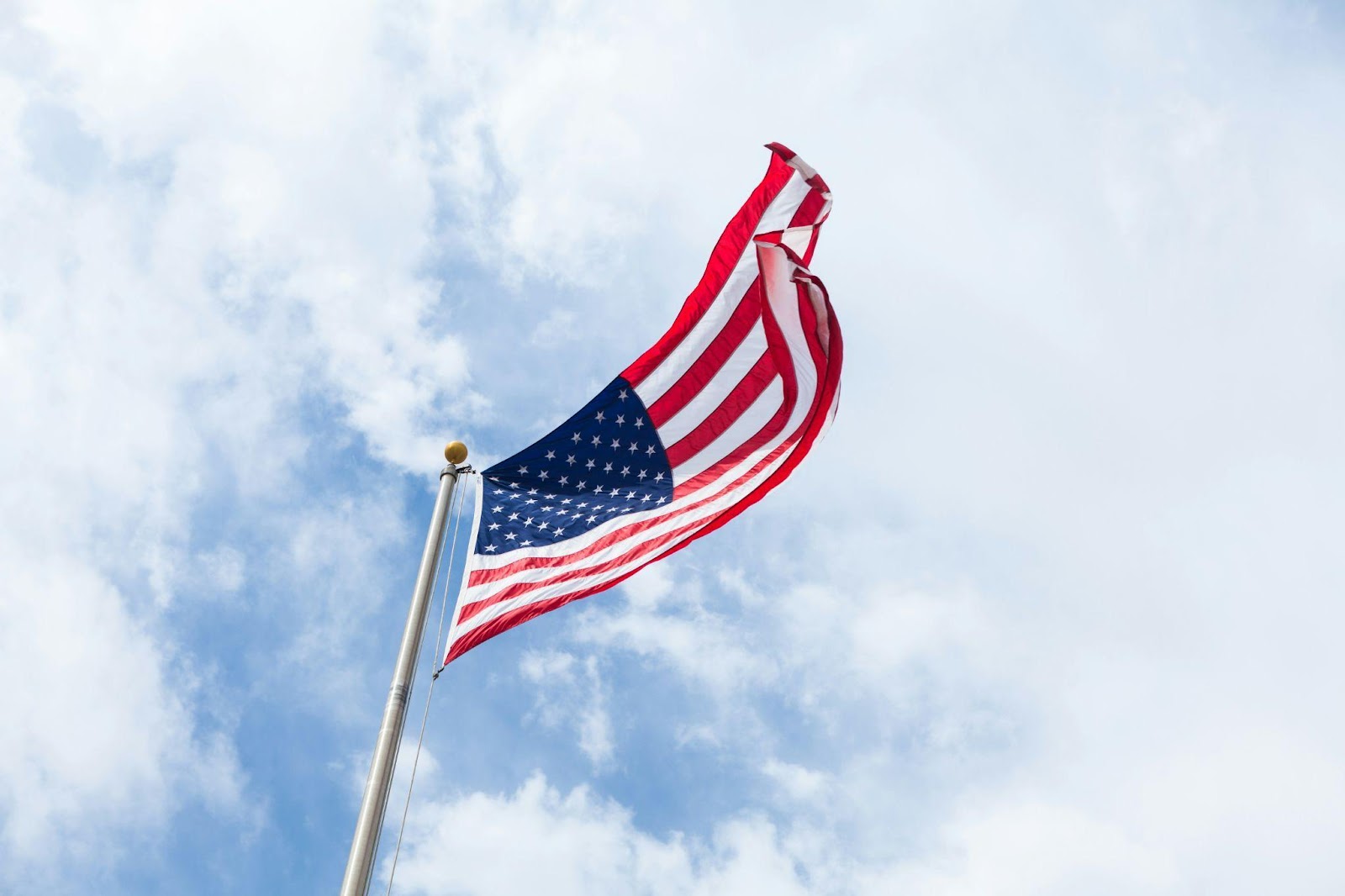 an American flag waving in the air
