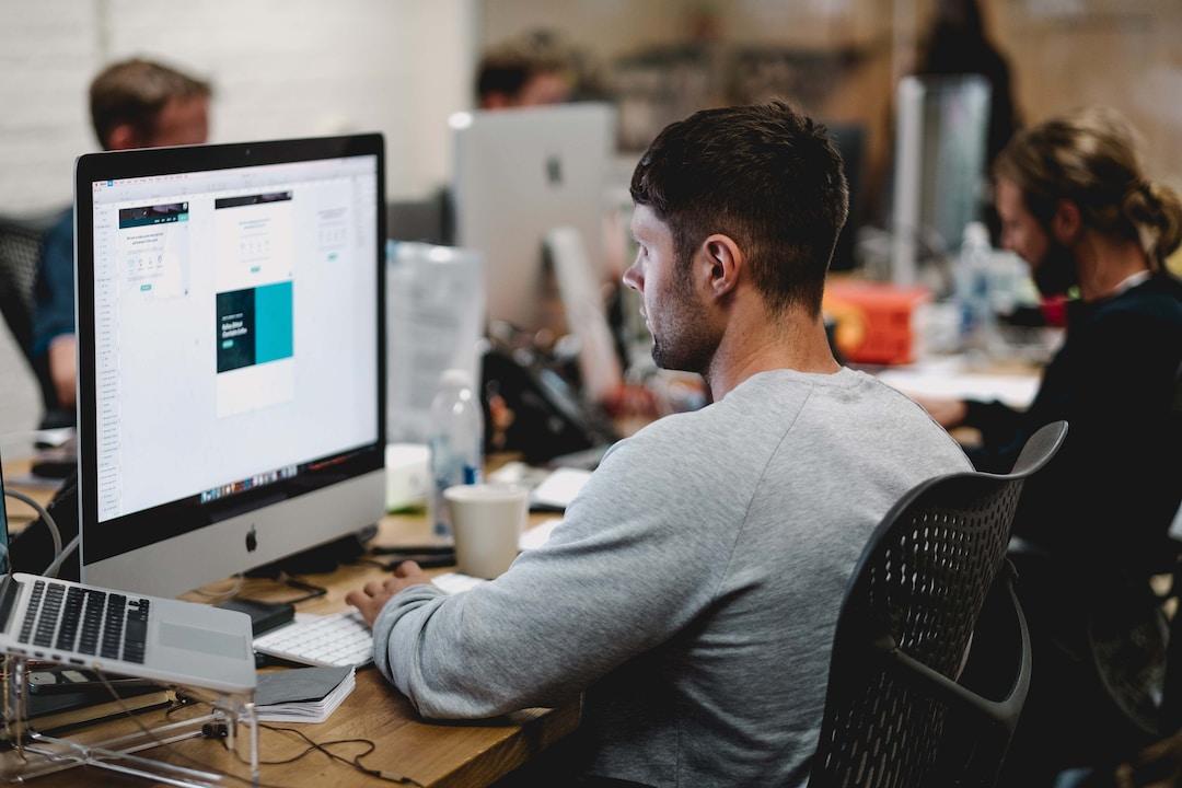 A man in an office researching digital customer service