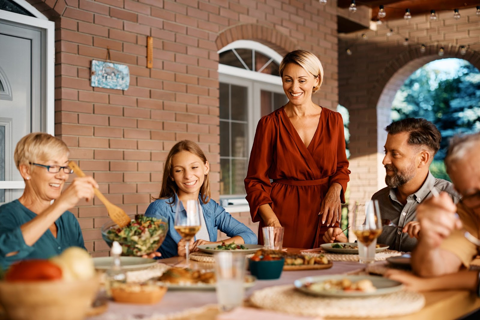 Family Sitting Down for Outdoor Meal