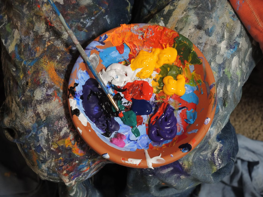 Body paint and panting brush in a bowl