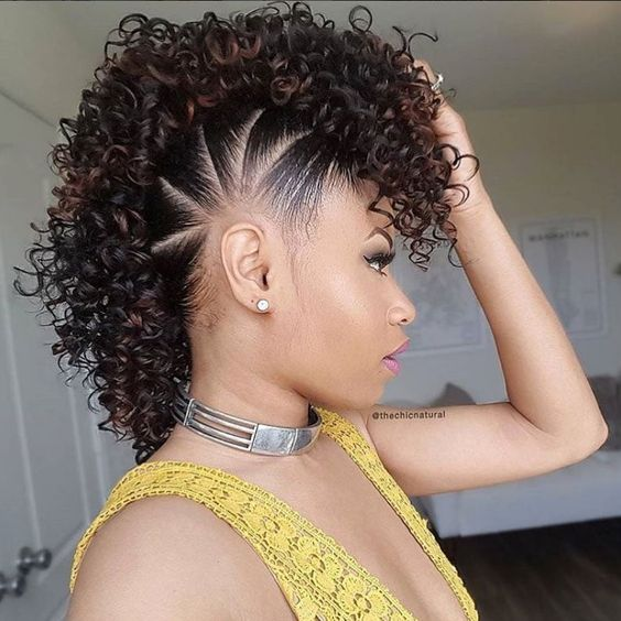 Side  view of a lady wearing the curly variation of the edgy  hairstyle 