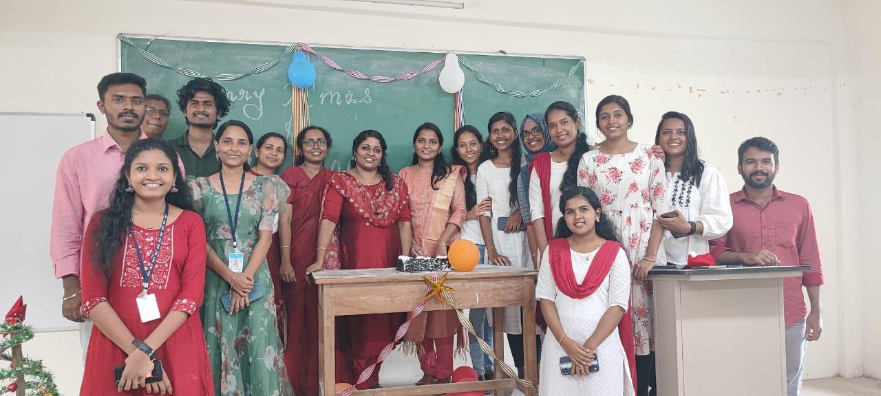 A group of women standing in front of a chalkboard

Description automatically generated