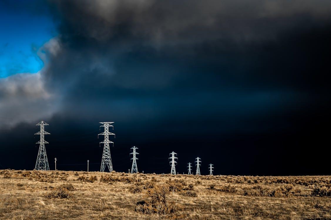 Free Electric Lines Over Cloudy Sky Stock Photo