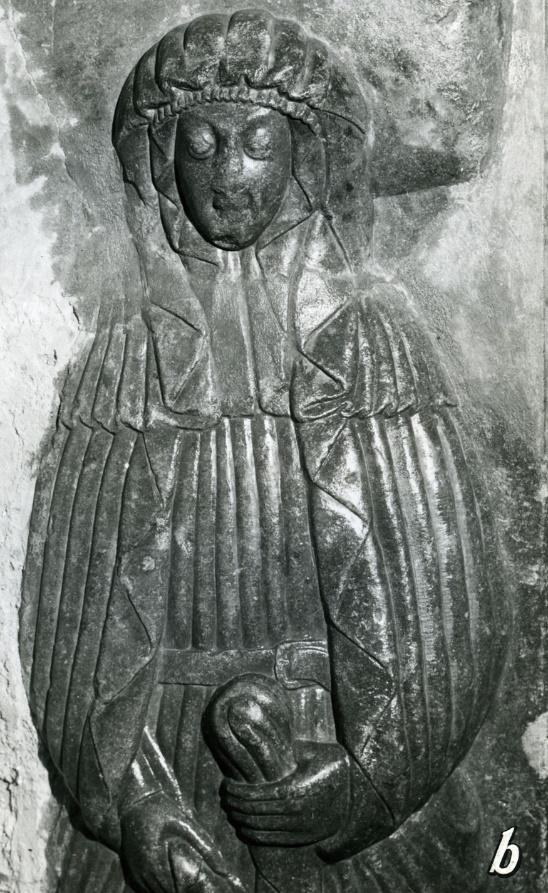 A stone carving of a person

Description automatically generated