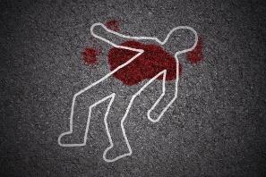 A white outline of a person lying on the ground with blood on it

Description automatically generated