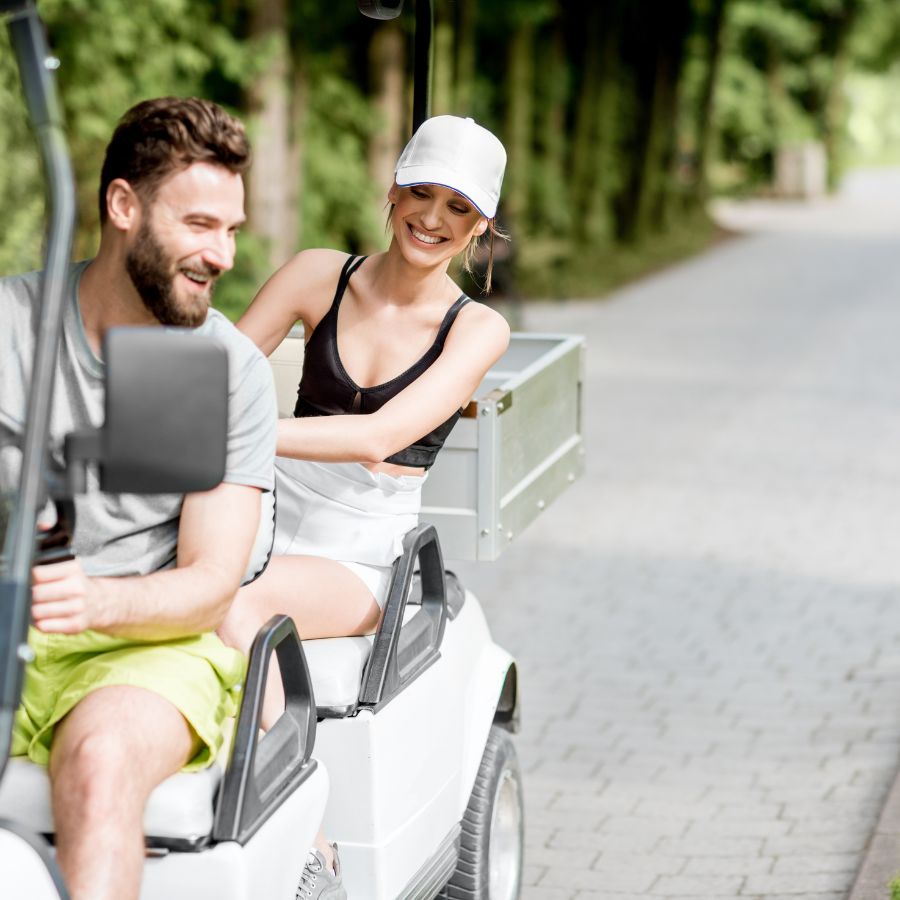 couple on a golf cart