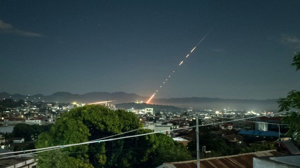 This long exposure picture taken late on October 28, 2023 shows a missile fired from a Myanmar military base in Lashio township, northern Shan State. Heavy fighting between rebels and the Myanmar military stretched into a second day near the country's northern border with China, armed groups said on October 28, 2023