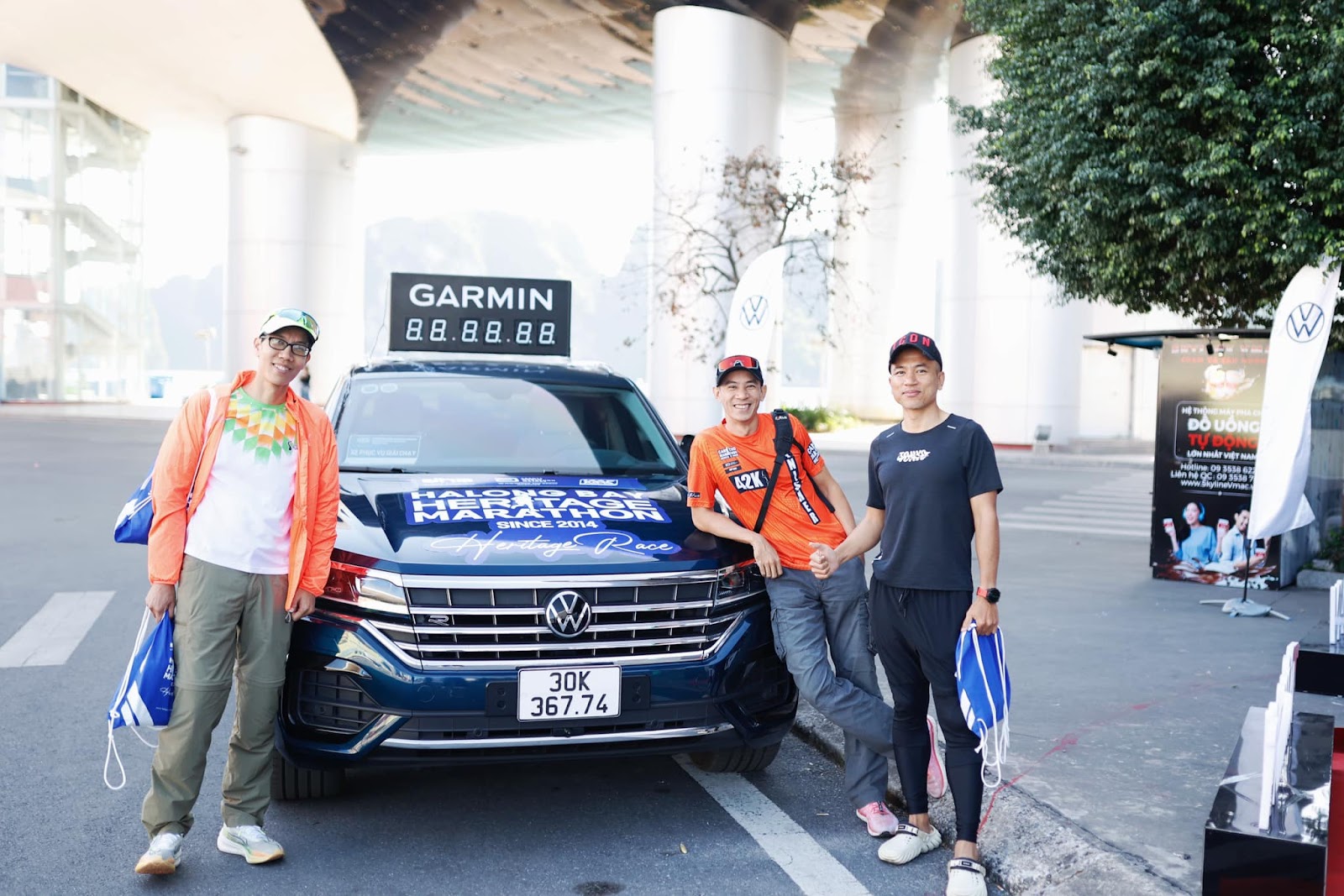 May be an image of 5 people, car, road and text