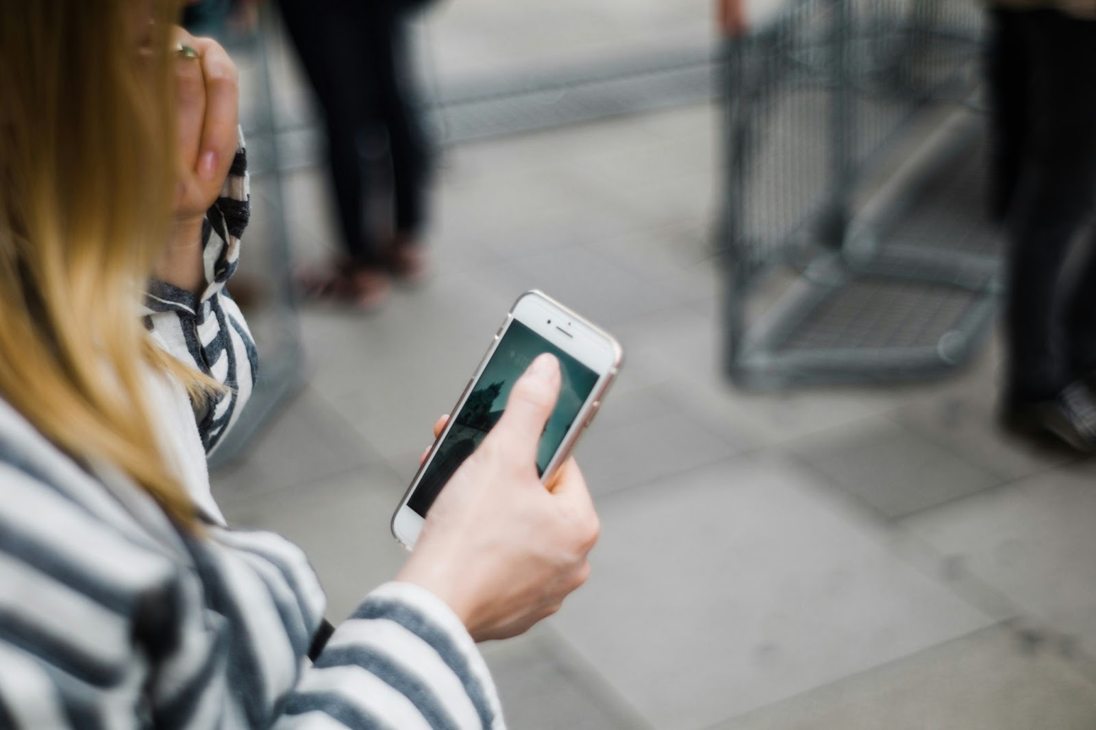 A woman using WhatsApp on her smartphone