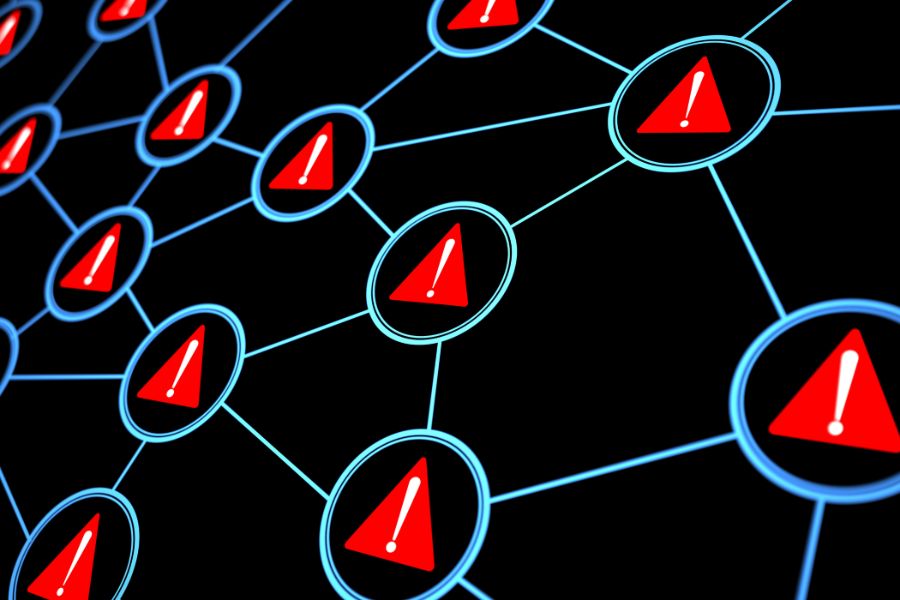 A network of red and blue triangles with a red warning sign indicating danger.