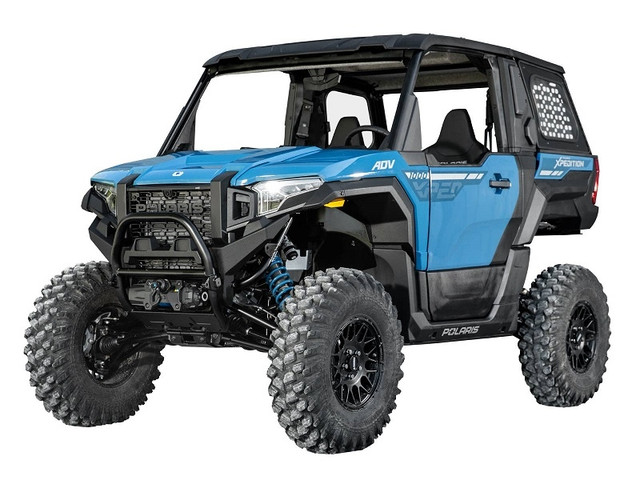 A blue and black Polaris Xpedition, parked and against a blank background