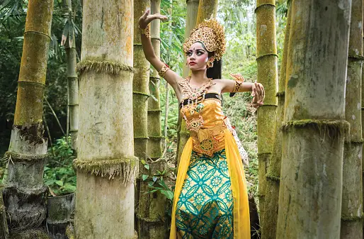 Young traditional Bali dancer in a bamboo forest