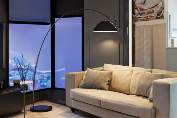 A Nordic-inspired floor lamp featuring a graceful arch, made of paint and metal, and equipped with an energy-saving LED bulb.