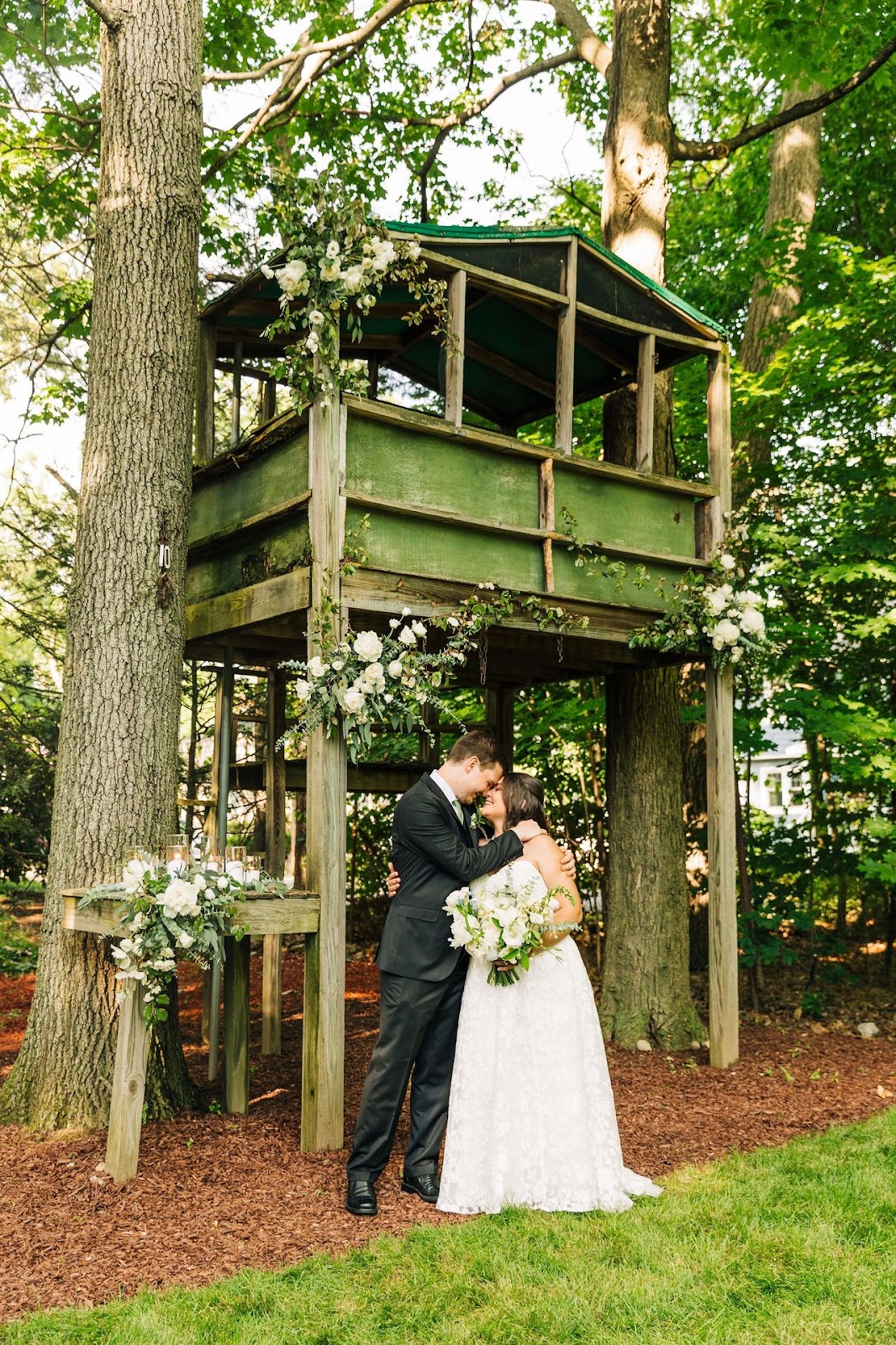 Childhood treehouse dressed for backyard wedding