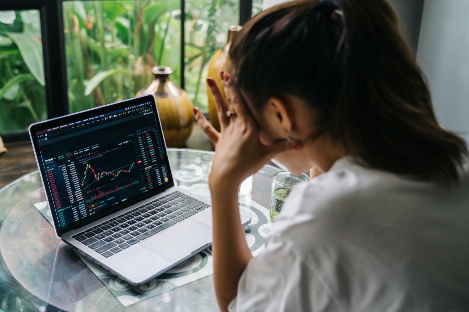 woman looking at a graphics on the laptop