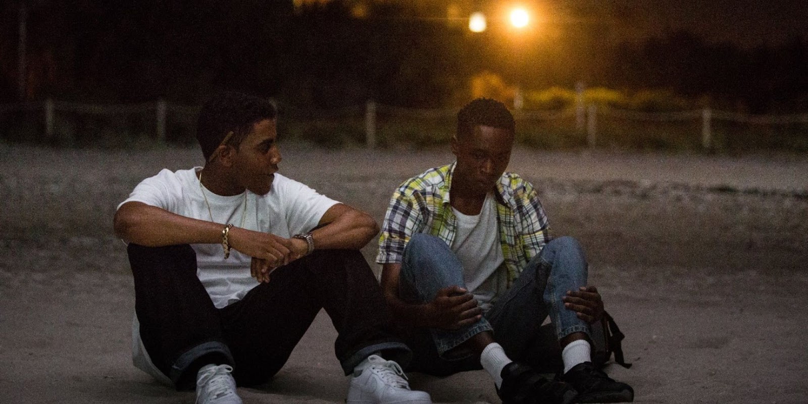 Ashton Sanders and Jharrel Jerome talking at the beach in 'Moonlight'