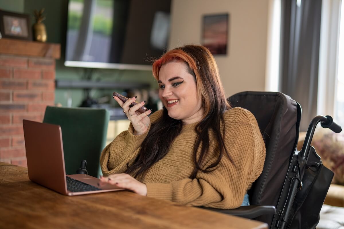 Employee in a wheelchair talking on the phone