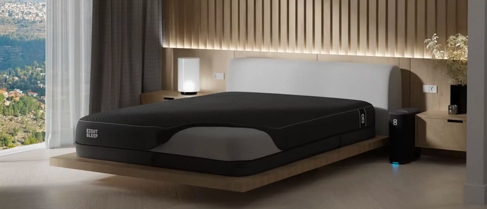 A modern bedroom with an Eight Sleep pod cover on its bed.