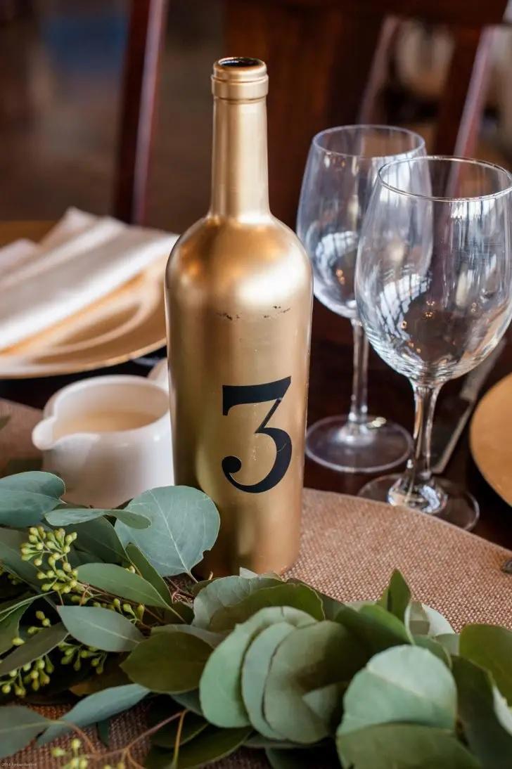 Upcycled tin-can centerpieces and wine-bottle table numbers.
