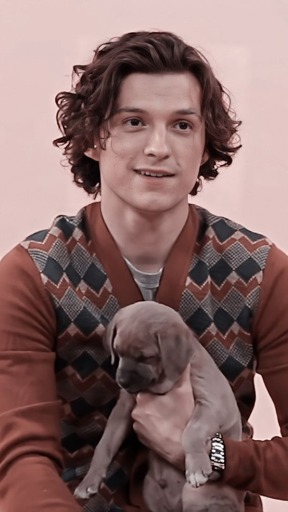 Picture of Tom Holland rocking his wavy hair 