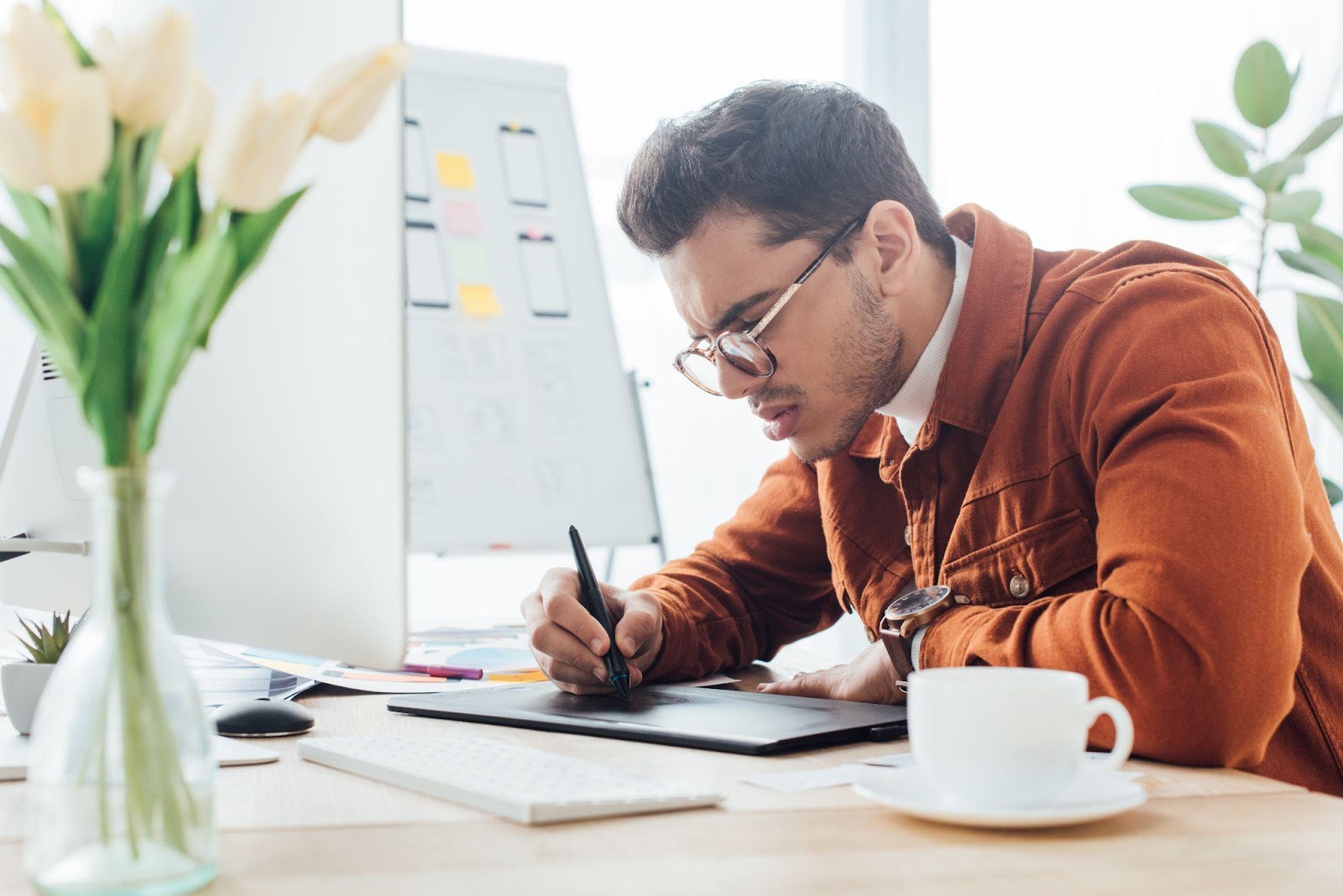 Graphic designer engaged on a tablet