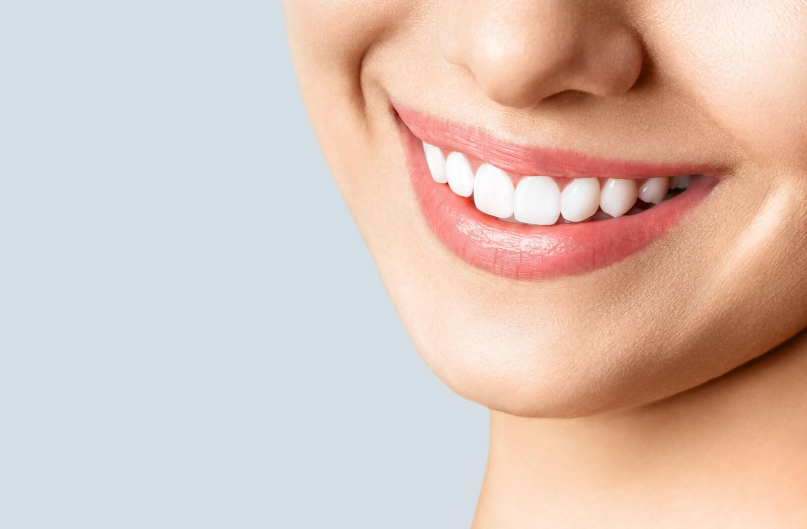 A close up of a woman's set of white teeth.
