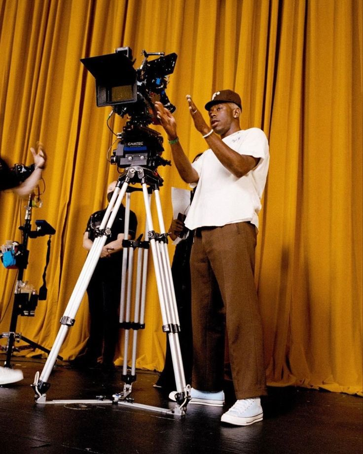 Tyler, the Creator Standing Near the Camera Giving Directions to Film a Song