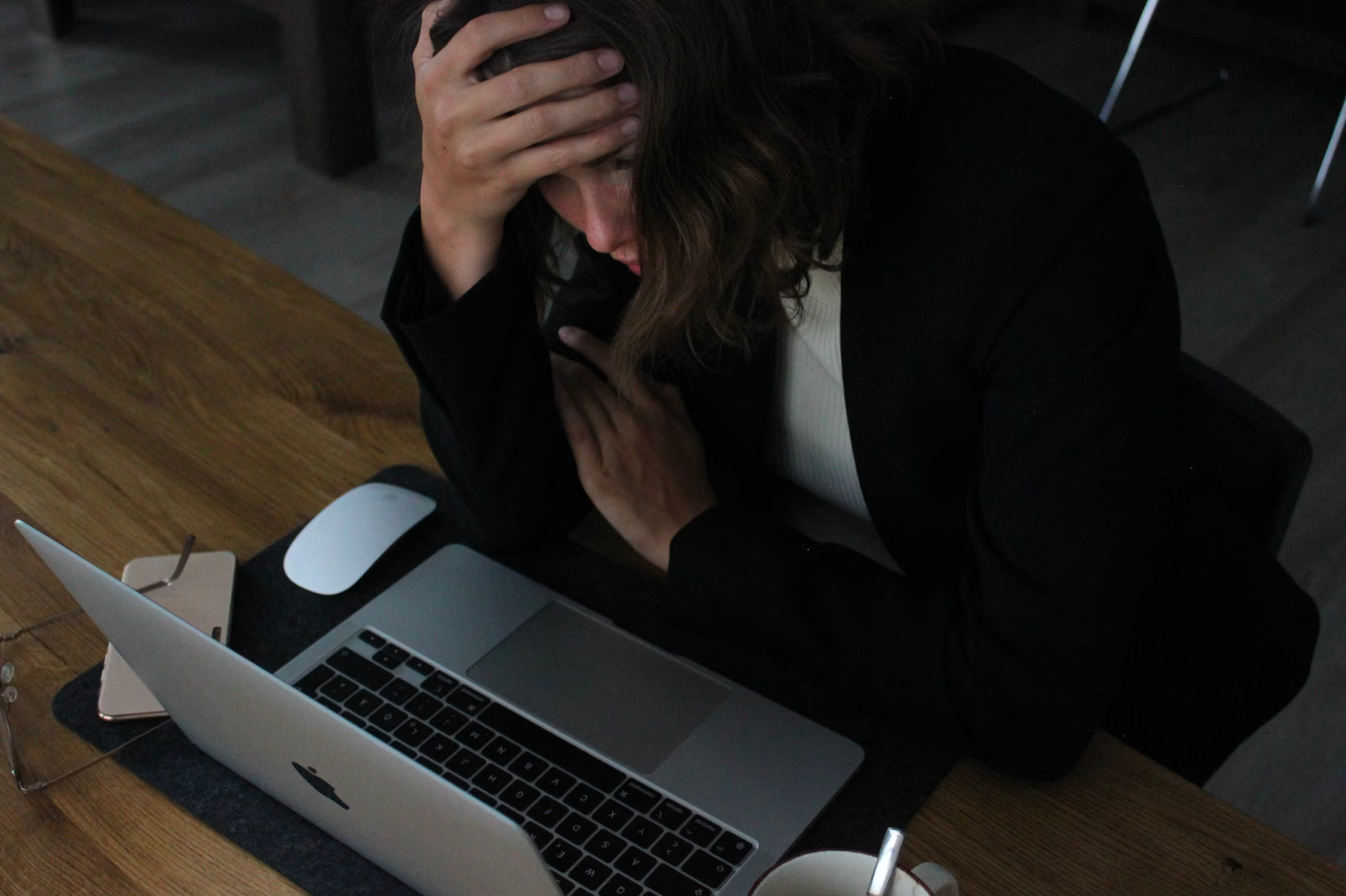 business woman burned out in front of computer desk 