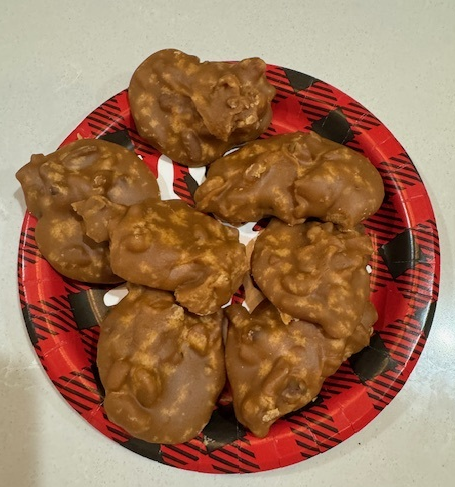 A plate of chocolate covered peanut butter cookiesDescription automatically generated