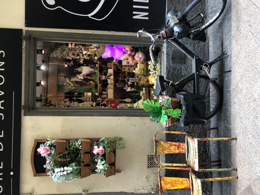A bicycle parked outside a store

Description automatically generated