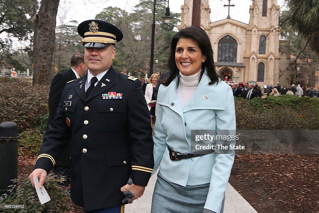 Governor Nikki Haley, joined by her family Michael, Rena and  Nalin, cross Sumter Street on their way to the State House after the Inaugural Prayer service held at Trinity Episcopal Cathedral, Wednesday morning.