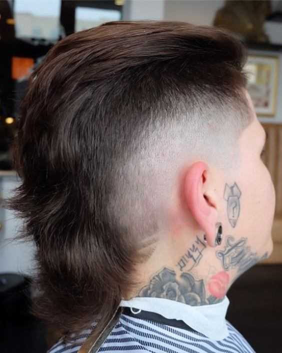 Back view of a guy wearing the modern mullet
