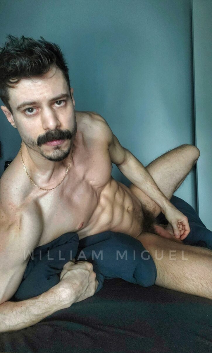 william miguel posing naked on the bed showing off his six pack abs showing off his flaccid dick