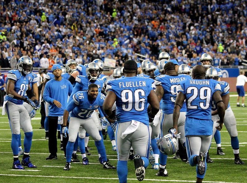The Detroit Lions Team coming to a Huddle